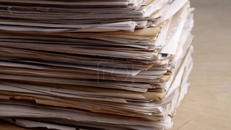 Photo for A very large stack of papers. Deadline, office overload, bureaucracy, paperwork. High quality 4k footage - Royalty Free Image