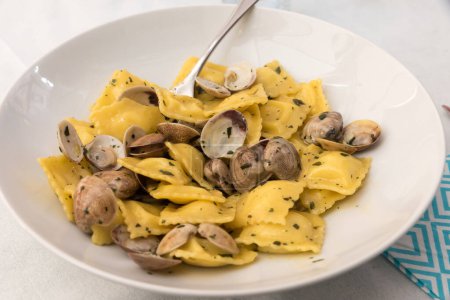 Photo for Stuffed ravioli with clams - Royalty Free Image