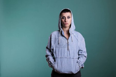 Photo for Portrait of unhappy upset woman looking nervous at camera while posing over isolated background in studio, having scary expression. Upset nervous female making disappointment grimacing - Royalty Free Image