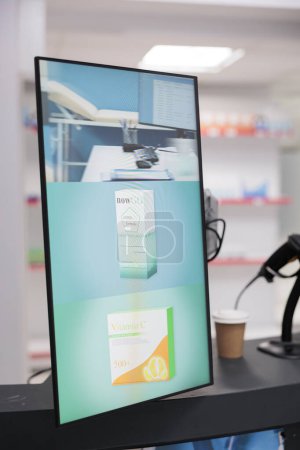 Téléchargez les photos : Health care facility counter desk with shelves showing drugstore adds and pharmaceutical products to cure illness, boxes filled with vitamins and pills. Empty pharmacy treatment and medicine. - en image libre de droit
