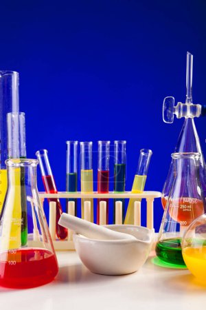 Photo for Lab set for chemistry with colored liquids in them. Glassware and biology equipment - Royalty Free Image