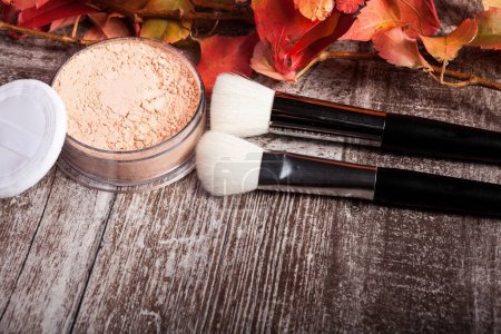 Photo for Professional cosmetics make up prducts in autumn concept on dark wooden background. Studio photo - Royalty Free Image