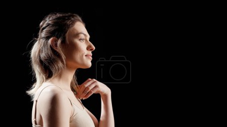 Photo for Beautiful girl feeling happy and natural with bare skin, posing in studio without makeup. Confident woman laughing and creating skincare ad campaign, promoting self acceptance body positivity. - Royalty Free Image