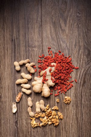 Photo for Dried fruits and nuts on wooden background. Healthy food - Royalty Free Image