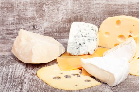 Photo for Different type of cheese on wooden background. Gourmet food apetizer - Royalty Free Image