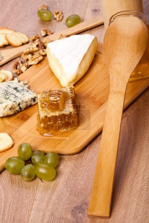Photo for Cheese apetizer on wooden background. Rustic food - Royalty Free Image