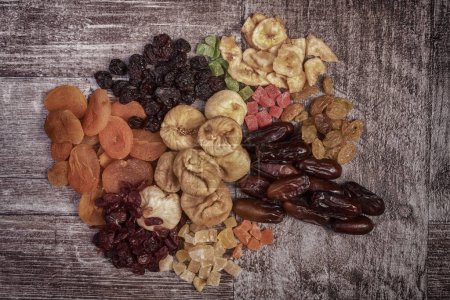 Photo for Different type of raw dried fruits on wooden type background in rich HDR toning. - Royalty Free Image