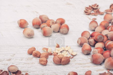 Photo for Nuts on white wooden background in studio photo. Healthy raw food - Royalty Free Image