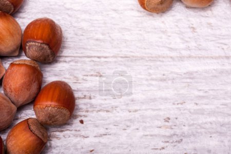 Photo for Nuts on wooden background in close up photo - Royalty Free Image