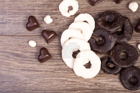 Photo for Heart shape Fruits in chocolate on wooden background - Royalty Free Image