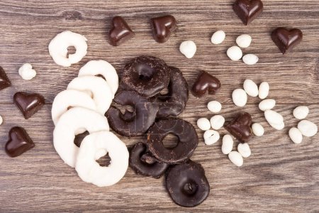 Photo for Heart shape Fruits in chocolate on wooden background - Royalty Free Image