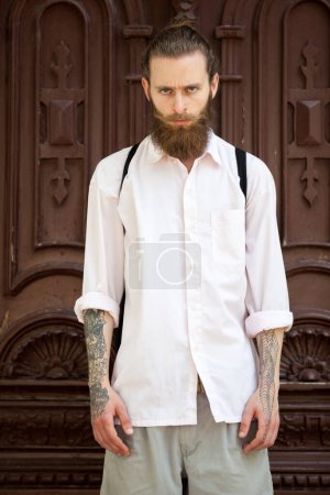 Photo for Portrait of tattooed hipster with long beard. Style and diversity - Royalty Free Image