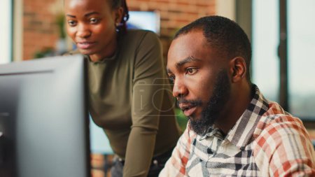 Photo for African american team of engineers working with 3d modelling software, brainstorming new ideas. Man and woman colleagues using artificial intelligence to create digital project at job. - Royalty Free Image