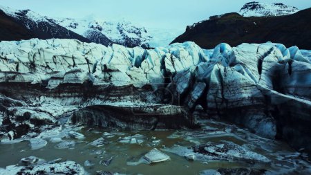 Photo for Aerial view of blue glacier rocks on vatnajokull ice cap in iceland, diamond shaped icelandic icy blocks. Spectacular icebergs and crevasses forming amazing nordic landscape. Slow motion. - Royalty Free Image