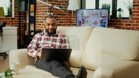 Photo for Employee having online discussion with coworker in video call meeting, remotely working from cozy stylish home office. Teleworker in video conference over the internet with collegue - Royalty Free Image