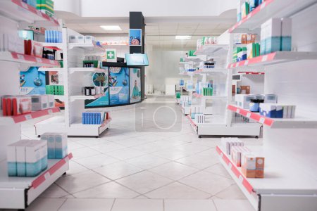 Photo for Drugstore shelves filled with medications and supplements ready to be buy by customer, health care treatment. Empty pharmacy with pharmaceutical products, supplements and vitamins, drugs bottles. - Royalty Free Image