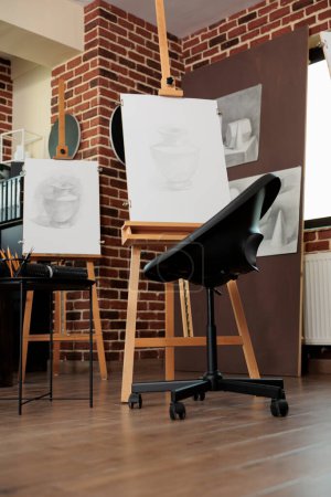 Photo for Art classroom interior with easels and drawing tools, nobody. Sketching classes and workshops in fine art for adults, sketch artworks in empty artist studio. Hobby to develop creativity - Royalty Free Image