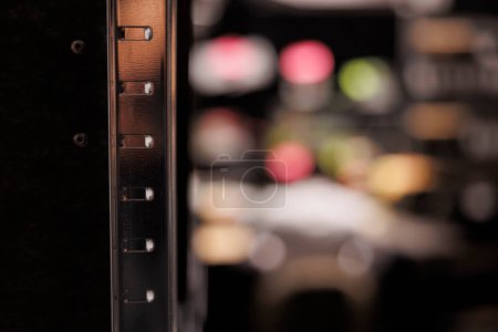 Photo for Metal shelf for folders with reports documentation in empty police investigator office. Rack for crime case files in blurred private detective agency close up selective focus - Royalty Free Image