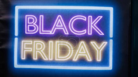 Photo for Glowing black friday sale signs on entrance front door at mall, local clothing store offering promotions and big discounts during seasonal sale. Clothes shop marketing advertisement. - Royalty Free Image