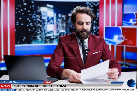 Real time updates about superstorm in news studio, broadcaster presenting natural disaster on island coast. Journalist covering storm report on breaking news segment live, night show.