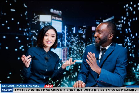 Photo for Journalists talk lottery winner kindness donating money to charity, lucky citizen sharing fortune with poor people. Team of tv reporters discussing about generous common person. - Royalty Free Image