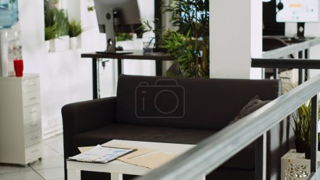 Photo for Startup department with workstations, computers at work desks used for company tasks in urban building agency. Empty small business office with stationary and supplies, executive job. - Royalty Free Image