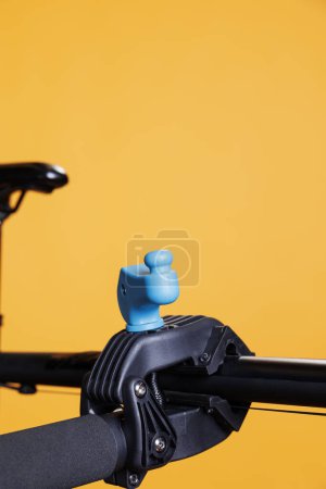 Photo for Photo focuses on the clamp used to secure the bicycle body while doing repairs. A wrecked bike is put on a workstand and seen in close-up. Service and upkeep for ideal cycling. - Royalty Free Image