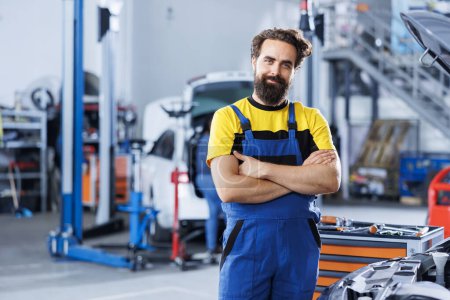 Photo for Portrait of happy serviceman in auto repair shop tasked with changing cars oil. Experienced specialist in garage ready to start doing checkups on vehicles in garage workspace - Royalty Free Image