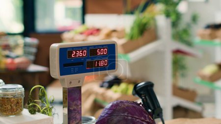 Photo for Modern grocery store scale in empty shop used in small business organic farming, freshly harvested produce. Sustainable zero waste supermarket with natural organic fruits and vegetables. Close up. - Royalty Free Image