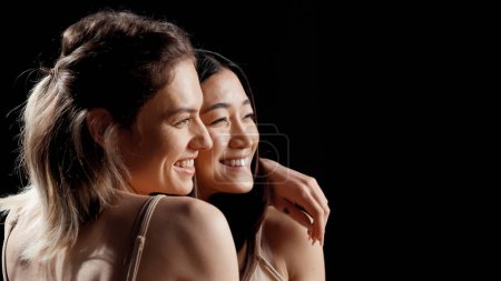 Photo for Smiling women with different skintones and body types posing in skincare campaign, promoting body positivity, self confidence and self love. Interracial friends laughing and having fun. - Royalty Free Image