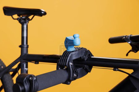 Photo for Photo focus on repair-stand clamp used for securing bicycle body for adjustments. Close-up shot of damaged bike placed and supported on workstand. Maintenance and service for optimal cycling. - Royalty Free Image