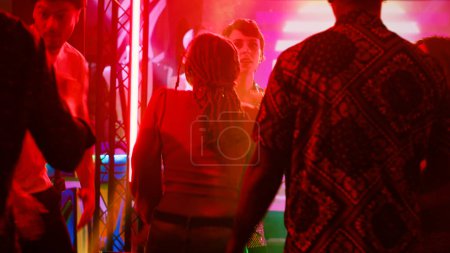 Photo for Underground party interrupted by police, funky people at club running away from law enforcement officers. Group of friends getting scared after seeing police siren lights, cultural diversity. - Royalty Free Image