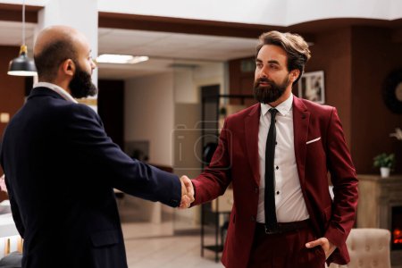 Photo for Business partners shake hands after meeting, deciding to work together on future collab, successful international conference. Two professionals agreeing to collaborate, forge alliances. - Royalty Free Image