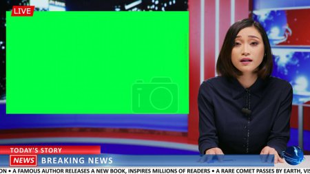 Asian journalist does newscast with greenscreen on live tv program, presenting daily news and important events. Woman news anchor covering latest topics for content, isolated copyspace mockup.