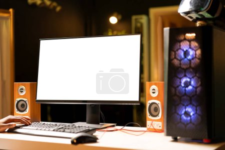 Photo for Player using keyboard and mouse to play singleplayer videogame on gaming computer isolated screen monitor. Person in home using computer peripherals to compete in using mockup display - Royalty Free Image