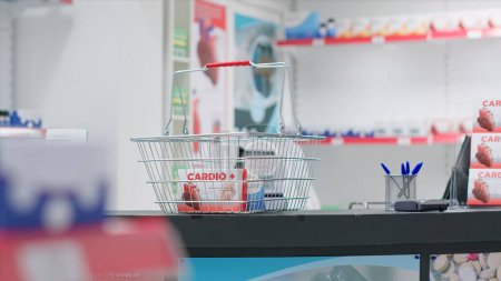 Photo for Empty pharmacy checkout counter with boxes of medicine, selling modern pills or pharmaceutical drugs on shelves in drugstore clinic. Medical supplies are for sale along with other treatments. - Royalty Free Image