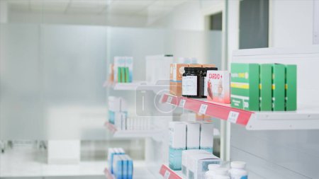 Photo for Selective focus of medicaments and supplements on shelves, empty pharmacy stacked with prescription medicine and medical supplies. Drugstore having antibiotics and pharmaceutics for sale. - Royalty Free Image
