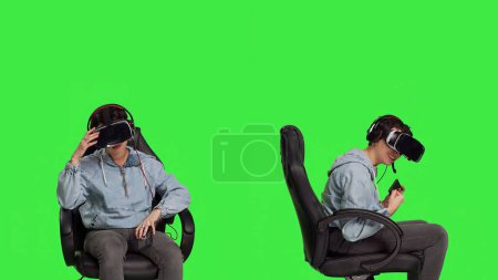 Woman gamer losing and winning at mobile video games against greenscreen backdrop, playing with virtual reality headset. Girl feeling cheerful and disappointed with win and failure. Camera B.