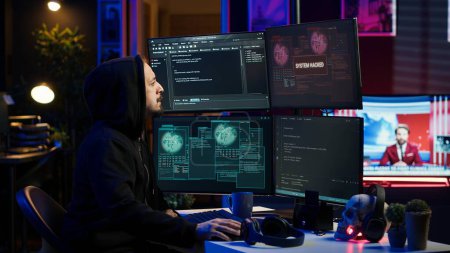 Frustrated hacker in secret hideout dejected after failing to attack victims using malware. Annoyed scammer feeling upset after being unable to hack computer systems, camera A