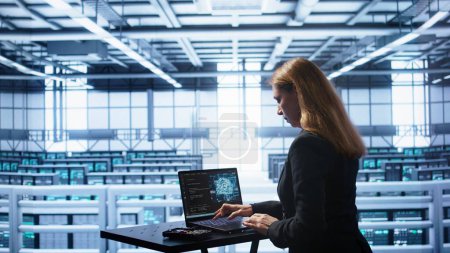 Admin in data center works with artificial intelligence computerized model simulating human brain. Employee working on notebook with AI machine learning algorithms using pattern recognition, camera B