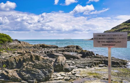 Photo for A beautiful place on the northernmost tip of a rocky headland on the tip of Australia. Sign at the tip - Royalty Free Image