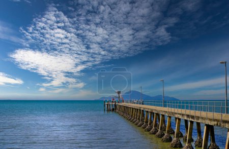 Photo for Cardwell is a coastal town on the beachfront North Queensland overlooking Hinchinbrook Island. View of the jetty and the Islands - Royalty Free Image