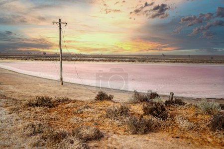 Photo for Lake Tyrrell is a unique salt lake covered by shallow water. Evaporation leaves a salt crust which is then mined. It is the largest inland saltwater lake in Victoria. A shallow salt-crusted depression of 70 square miles (180 square km) in the Mallee - Royalty Free Image