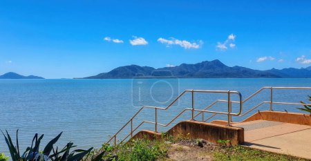 Photo for Cardwell North Queensland overlooking Hinchinbrook Island. View from the beach on a calm day - Royalty Free Image