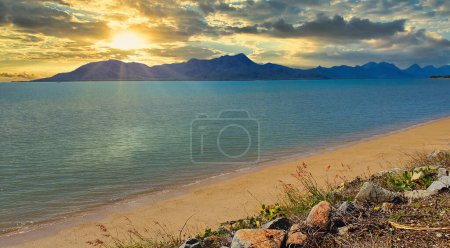 Photo for Cardwell is a coastal town on the beachfront North Queensland overlooking Hinchinbrook Island. View from the beach - Royalty Free Image