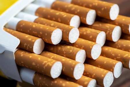 Photo for Close up cigarette in pack is addictive to be cancer. smoking reduction campaign in World No Tobacco Day - Royalty Free Image