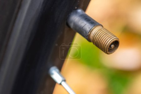 Photo for Nipple on bicycle rim for tubeless system close-up. - Royalty Free Image