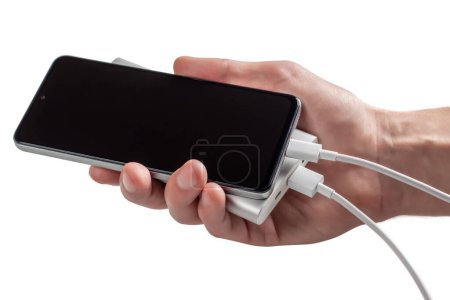 Foto de Smartphone de mano con powerbank. Aislado sobre blanco - Imagen libre de derechos