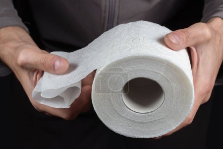 Photo for Close-up of in Hand using a toilet paper - Royalty Free Image