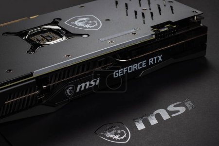 Photo for UKRAINE, DNIPRO, FEBRUARY 23, 2023: MSI Geforce RTX graphics card, Hardware components for build PC or mining rig. Backplate - Royalty Free Image